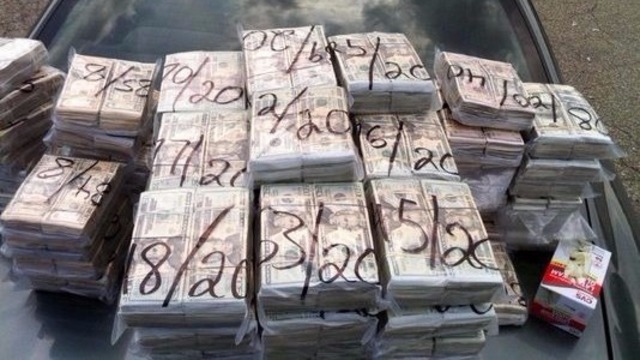Corrupt cop threw money at strippers
