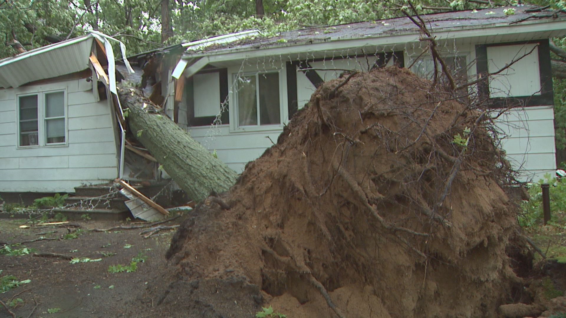 Storm damage: tree crushes house, truck | wzzm13.com